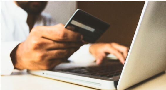person entering credit card information online